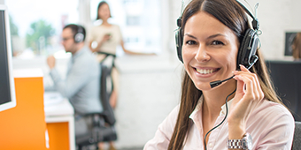 woman with headset on calls